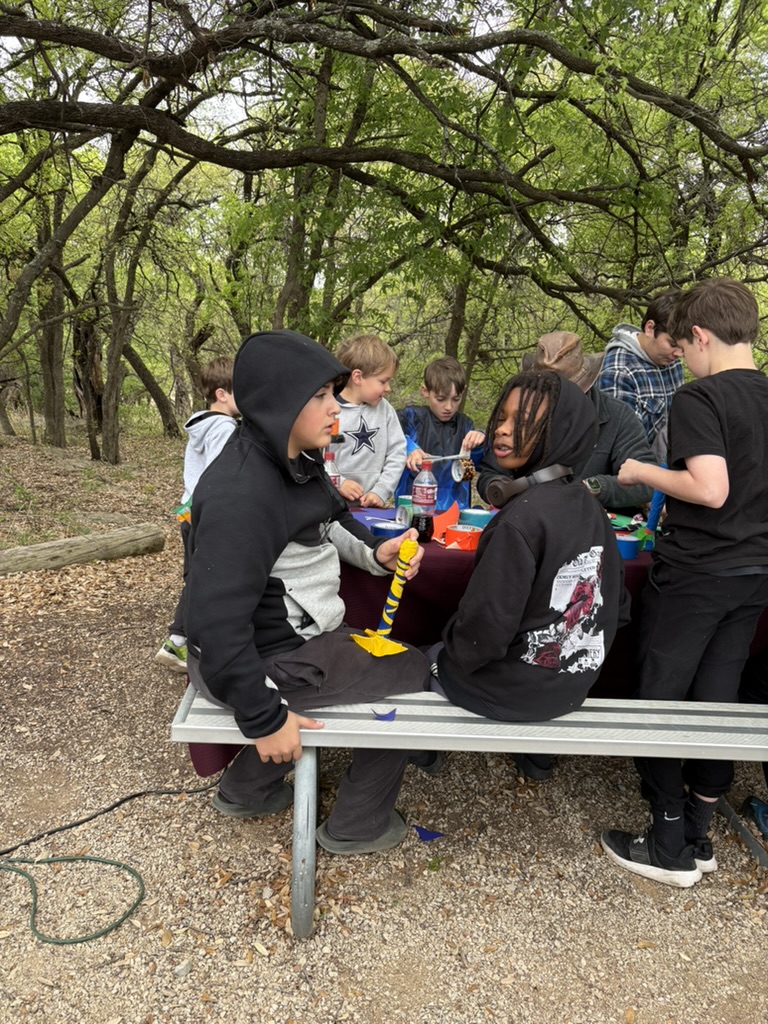 Boys doing crafts at campout